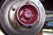1990 Ford Bronco - Wheel bearing assembly packed with red grease, adjacent to the brake rotor.