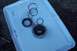 1990 Ford Bronco - Several metal automotive parts, including a gear and a ring assembly, are laid out with black o-rings on a white plastic surface.
