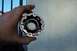 1990 Ford Bronco - A hand holds a metal component with internal splines, likely a vehicle part.