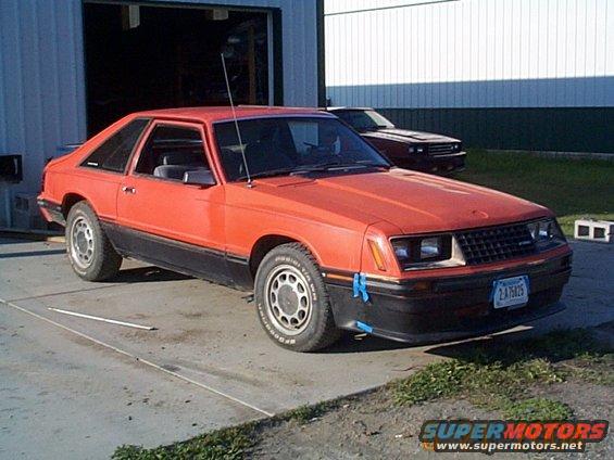 1983 Mercury Capri coupe parked outside a garage with another car behind it