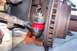 1990 Ford Bronco - This is a close-up view of a vehicle's steering and suspension components, specifically a ball joint and tie rod end.