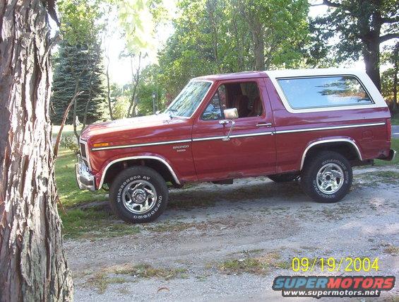 Red 1985 Ford Bronco side view