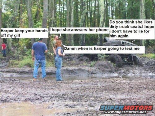 Muddy off-road vehicle stuck in woods with people around