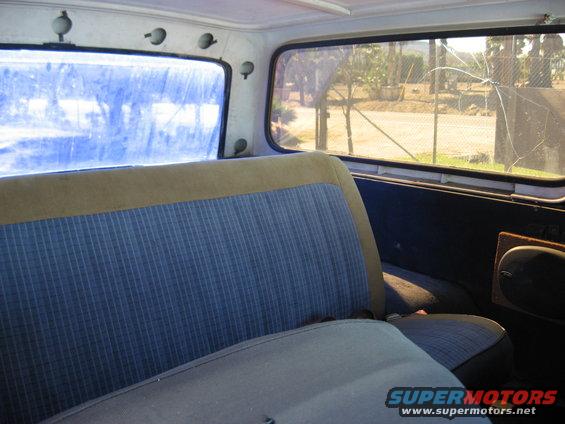 Interior view of a 1979 Ford Bronco showing the rear seat and windows
