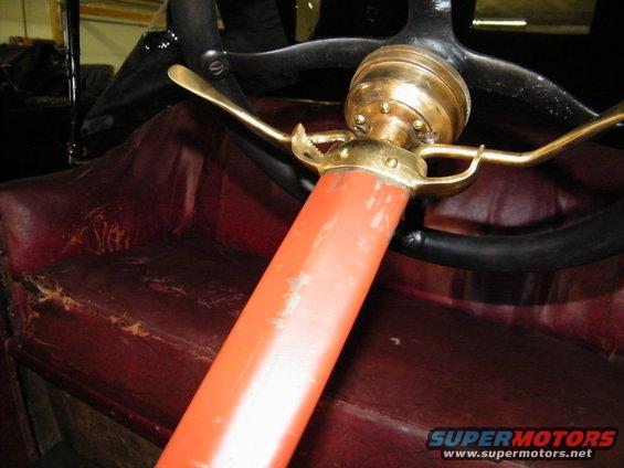 1913 Ford Model T interior showing red leather seats and steering column with brass accents