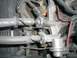 2000 Mercury Grand Marquis - Close-up of an engine fuel line, showing the text 'FUEL ABS' printed on it.