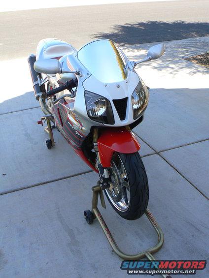 Red and white sport motorcycle on stands