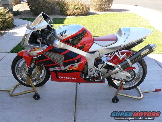 Red and silver Honda RVT racing motorcycle on stands