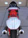 1978 Ford Bronco - This motorcycle features a distinctive red, white, and black paint scheme with dual exhaust pipes visible from the rear.
