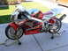 1978 Ford Bronco - Honda RC51 sportbike with red and silver livery, displayed on stands.