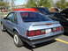 1986 Ford Mustang - Rear view of a light blue 1986 Ford Mustang LX coupe parked in a lot.
