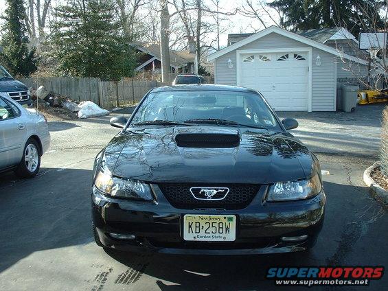 Black 2002 Ford Mustang front view with hood scoop and New Jersey plate KB-258W