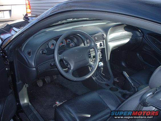 2002 Ford Mustang interior showing dashboard, steering wheel, and seats