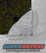 Close-up of a metal weld with "SUPERMOTORS www.supermotors.net" text at the bottom