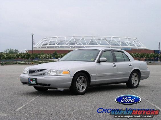 Silver 2001 Ford Crown Victoria sedan parked in a lot