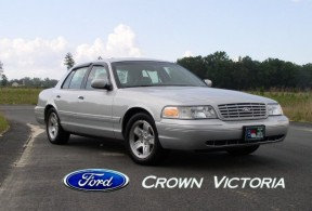 Silver 2001 Ford Crown Victoria parked on a road