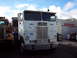 1981 Kenworth W900A - This white semi-truck features "The Class of '74" painted on its side, along with blue lightning bolt graphics.
