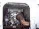 1981 Kenworth W900A - The engine compartment of a large truck, a large turbocharger and rusty exhaust pipes.