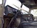 1981 Kenworth W900A - The interior of a truck cab shows the dashboard with multiple gauges and a large steering wheel.