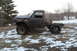 1980 Dodge Magnum - This heavily modified pickup truck appears to be a project vehicle, with significant body damage and a custom lift.