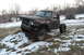 1980 Dodge Magnum - This heavily modified Dodge pickup truck, likely from the 1970s, is shown with significant front-end damage and oversized tires.
