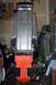 2004 Arctic Cat F-7 Firecat - The underside of a snowmobile chassis is shown, an orange plastic guard and a metal track bed.
