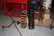 Rough Country 6 inch lift spring next to stock spring