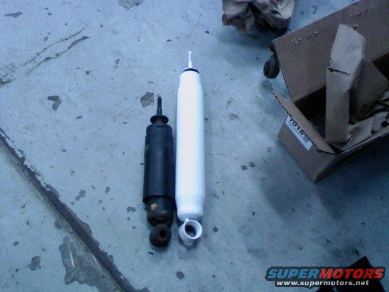 0207091256.jpg old stock shock next to new lifted length shock. these were wooped and I wouldn't be suprised if these were original 1986 shocks.