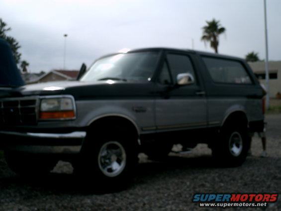 1994 Ford Bronco parked on gravel lot