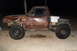 1980 Dodge Magnum - This heavily modified pickup truck features a flatbed conversion and oversized tires, suggesting off-road use. The body shows considerable…