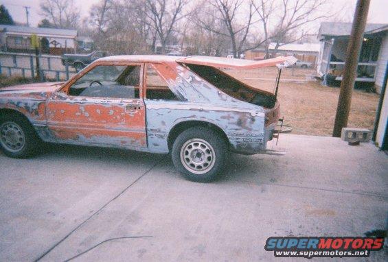 1983 Mercury Capri in primer with trunk open