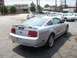2005 Ford Mustang - Silver 2005 Ford Mustang coupe seen from the rear three-quarter angle in a parking lot.