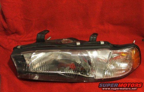 Automotive headlight assembly with clear lens and amber turn signal
