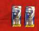 1989 Ford Bronco II - Two GE Super Blue halogen headlight bulbs are packaged for sale on a red surface.