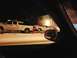 2003 Ford Crown Victoria - A tow truck is seen pulling a car on a snowy road at night, with a building in the background.