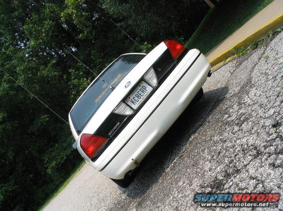 Rear of a white 1998 Ford Crown Victoria with a license plate reading KC8ERP