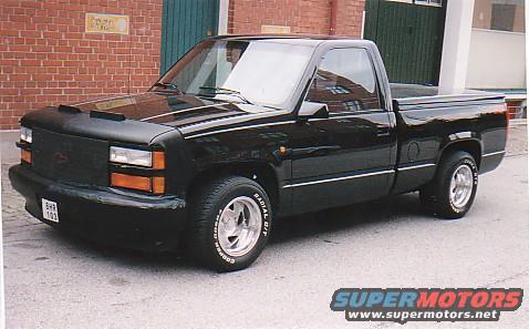 Black pickup truck, 3/4 front view. License plate BHR 103