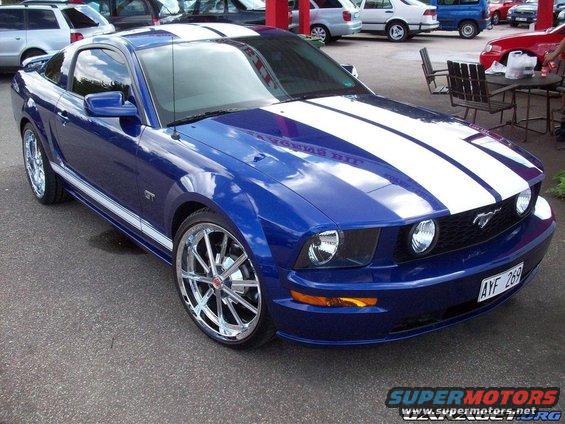 Blue 2005 Ford Mustang GT with white stripes and chrome wheels