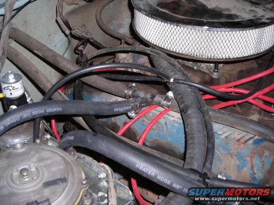 Engine bay with Goodyear heater hoses and air filter
