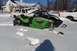 2004 Arctic Cat F-7 Firecat - Snowmobile parked in deep snow outside a building with a white pickup truck.