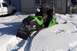 2004 Arctic Cat F-7 Firecat - A snowmobile sits in a snowy outdoor environment, with a white truck visible in the background.