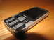 2003 Ford Crown Victoria - A Nokia cell phone rests on a wooden table, displaying its keypad and screen.