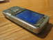 2003 Ford Crown Victoria - Nokia N82 phone with screen displaying icons and date 02/02/2009.