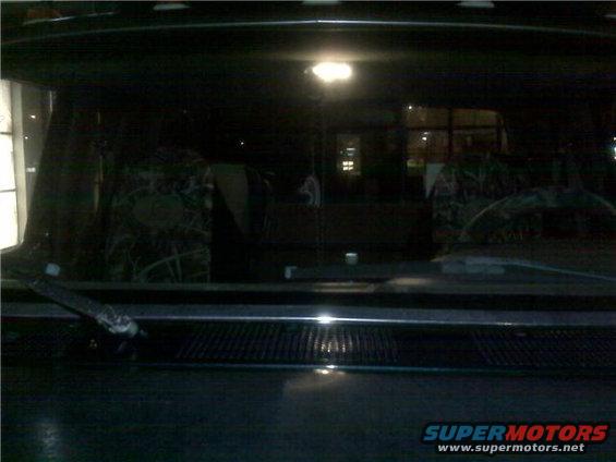Interior view of a truck with camouflage seat covers and a dashboard