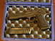 1992 Ford Bronco - A pistol and its magazine are stored in a protective case with foam padding.
