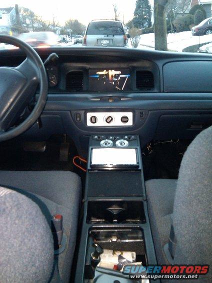 A shot of the center console and the screen in the dash. The headunit is a JVC touchscreen DVD unit with 5.1 channel pre-amp outputs, the console also houses the center channel and bass controls.