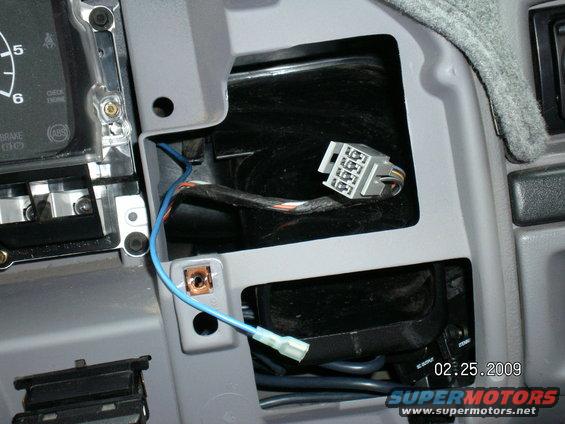 Here's where it came out from behind the cluster, right behind the 4X4 switch on the dash.