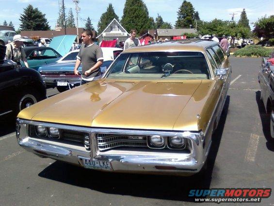 Gold station wagon with chrome grille and bumper, license plate 440-LKE
