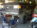 1990 Ford Bronco - This 1990 Ford Bronco is on jack stands, possibly for a SAS swap, with its front end elevated and large off-road tires visible.