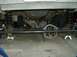 1990 Ford Bronco - Vehicle undercarriage with suspension work in progress, showing front axle and springs. Dated 03/01/2009.